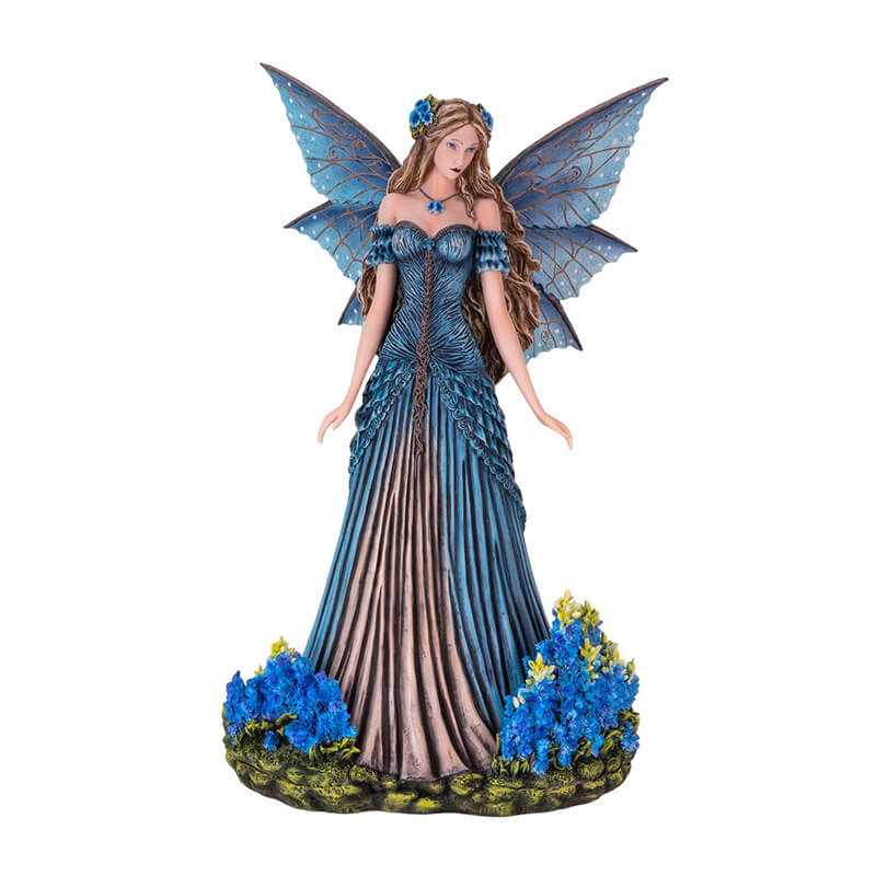 Figurine of a fairy in a blue dress with detailed blue wings and long hair, standing with bright indigo flowers.