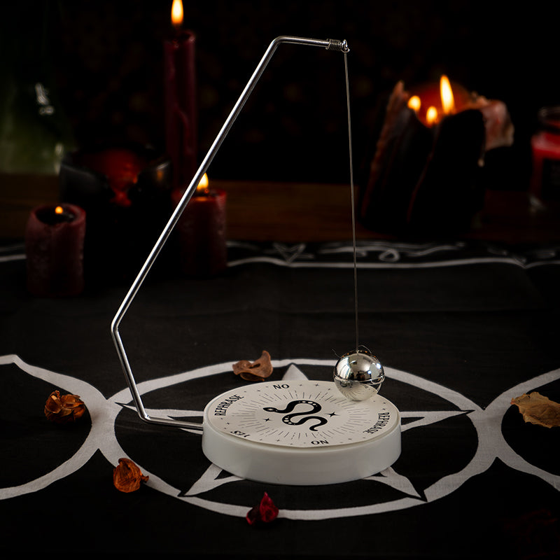 Pendulum decision maker with swinging metal ball and snake motif