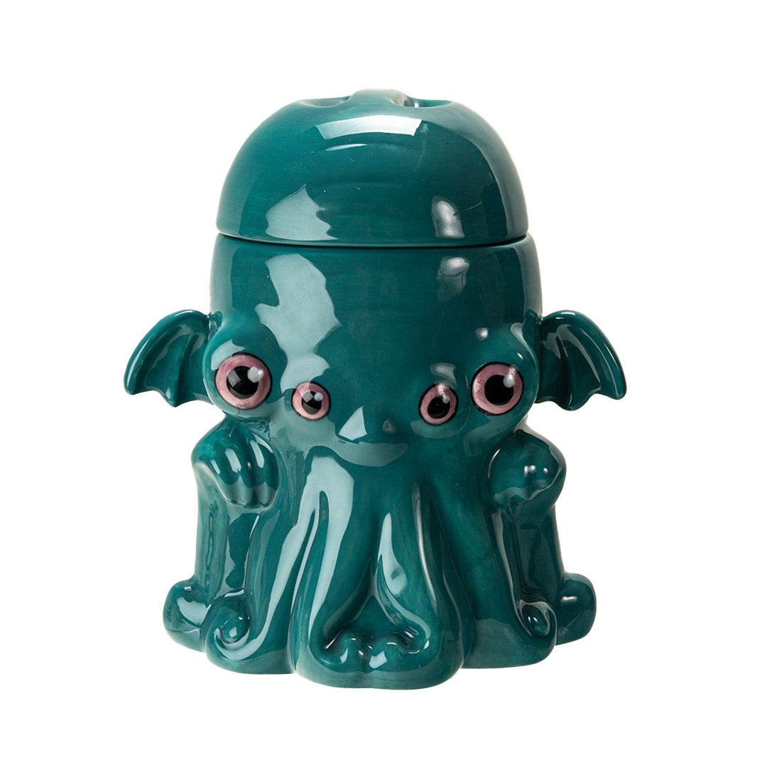 Ceramic cookie jar in teal, pink eyed, tentacled Cthulhu monster shaped