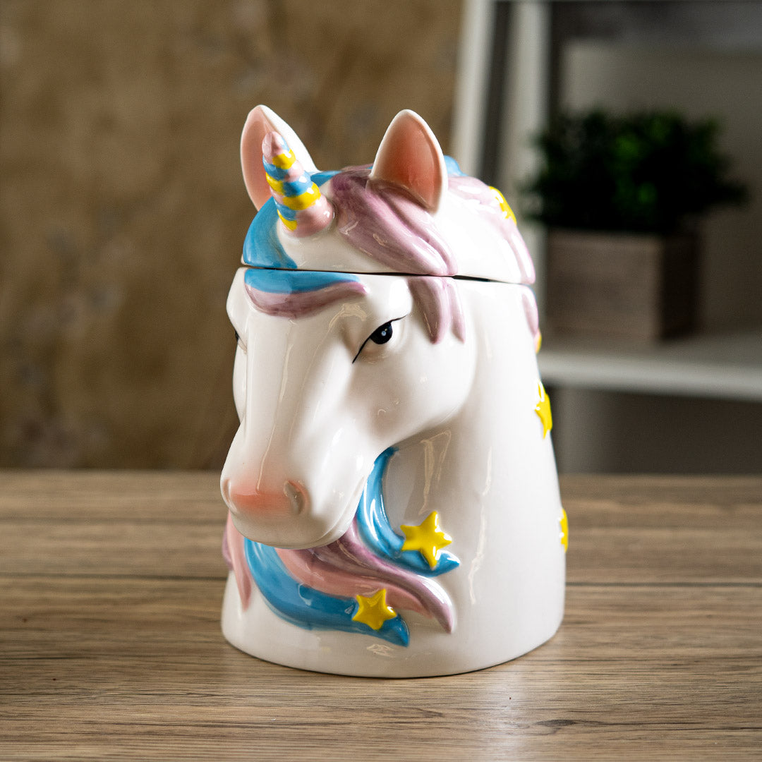 Ceramic unicorn head cookie jar, mane with pink and blue, horn with pink, blue yellow, and yellow stars