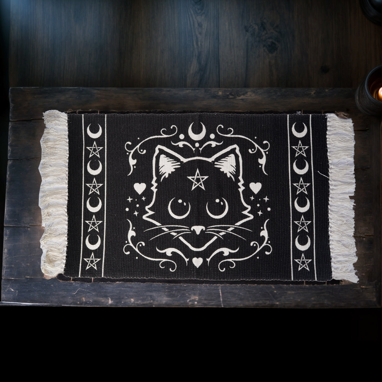 Cotton rug, white on black with fringe. Cat face with pentacle, moon and heart designs
