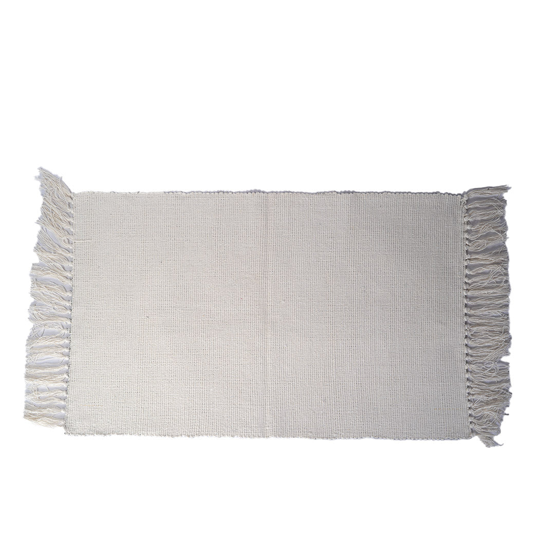 Back of rug, white backing with fringe