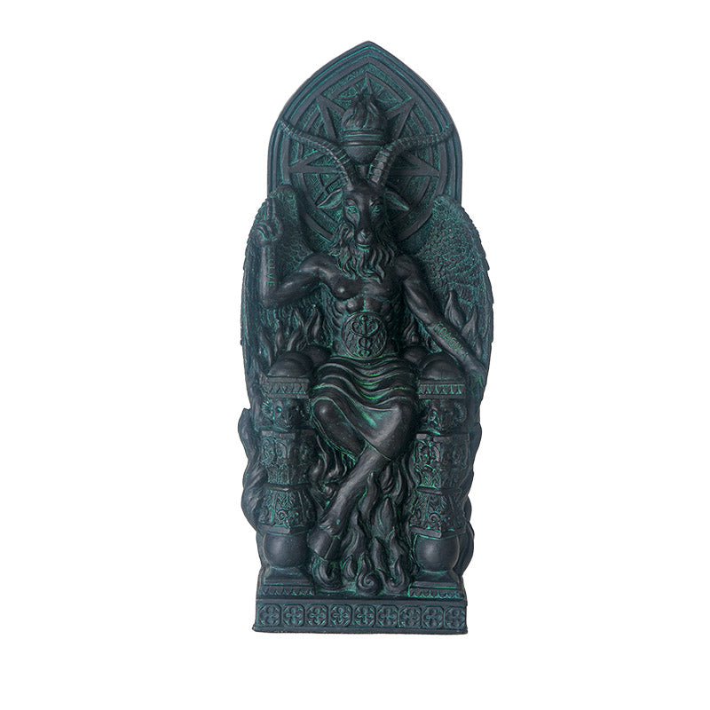 Figurine in dark teal faux-stone of seated Baphomet on throne with goat face, antlers, cloven hooves, symbols surrounding him