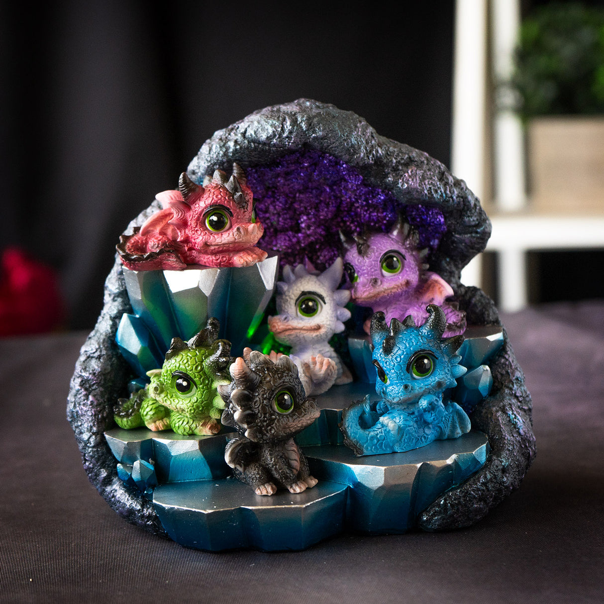 Set of 6 baby dragon figurines in red, purple, white, blue, green and black on geode rock display