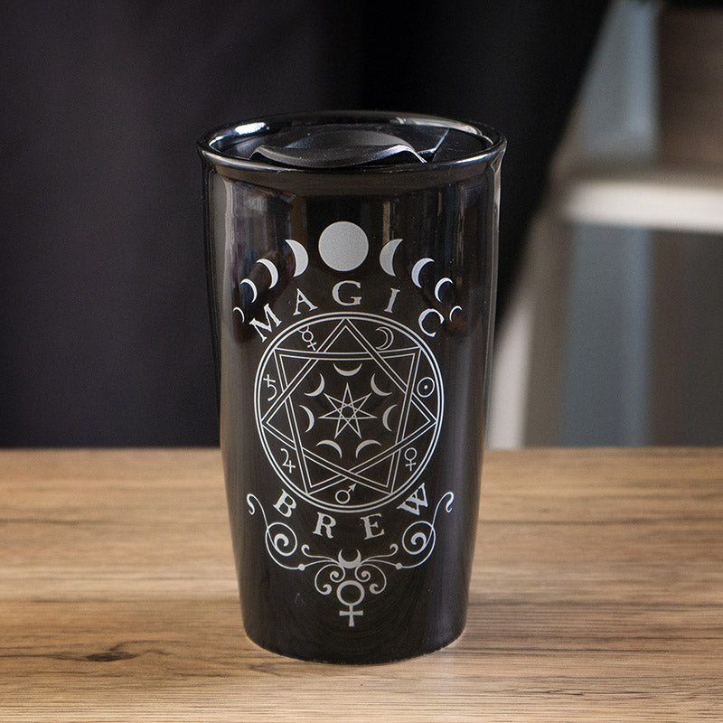 Black travel mug with 'Magic Brew' witchy design in white
