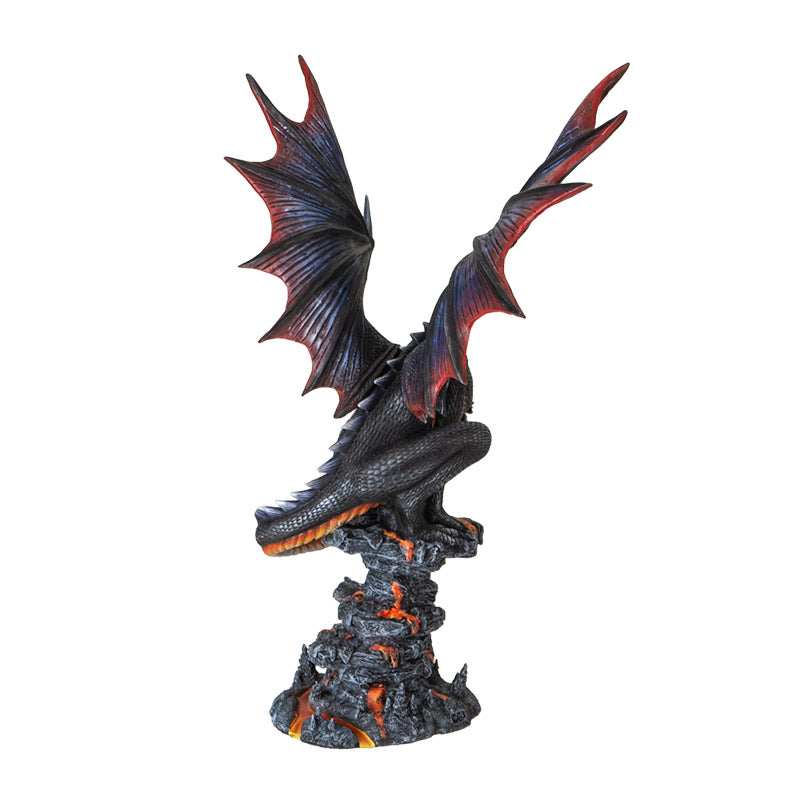 Figurine of a black dragon with blue, red, orange accents, perched snarling on a rocks with lava