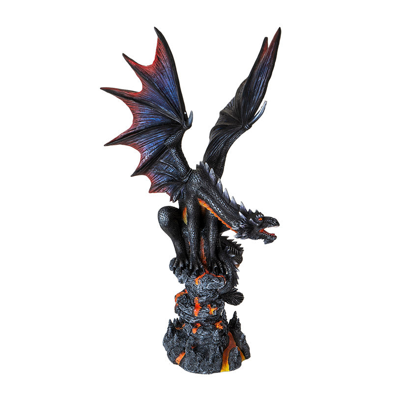 Figurine of a black dragon with blue, red, orange accents, perched snarling on a rocks with lava