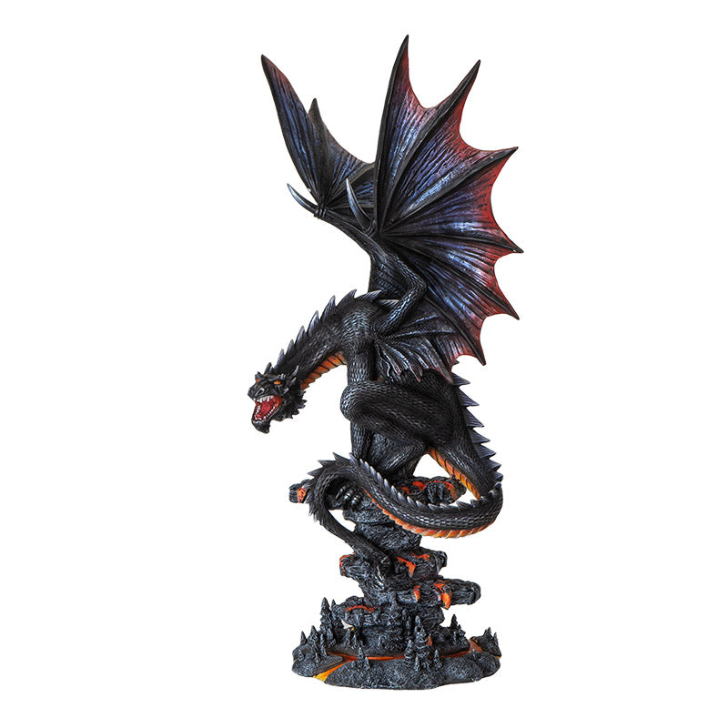 Figurine of a black dragon with blue, red, orange accents, perched snarling on a rocks with lava