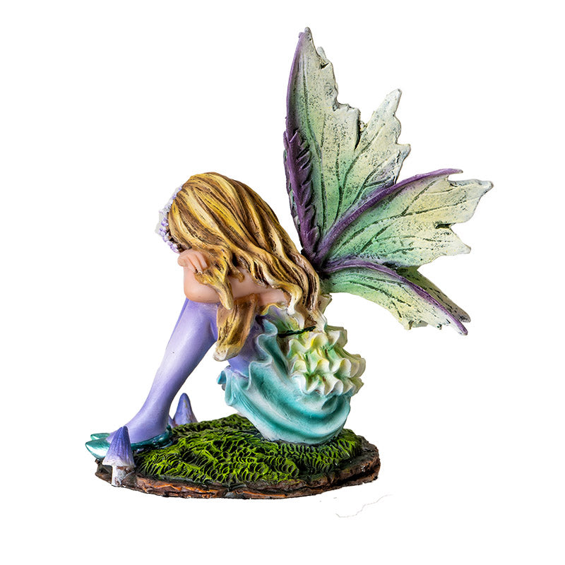 Fairy Figurine with blond pixie sleeping on moss, green wings & dress with purple stockings, accents, mushrooms