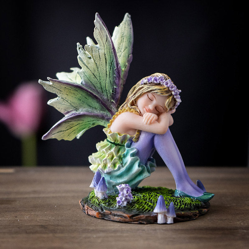 Fairy Figurine with blond pixie sleeping on moss, green wings & dress with purple stockings, accents, mushrooms