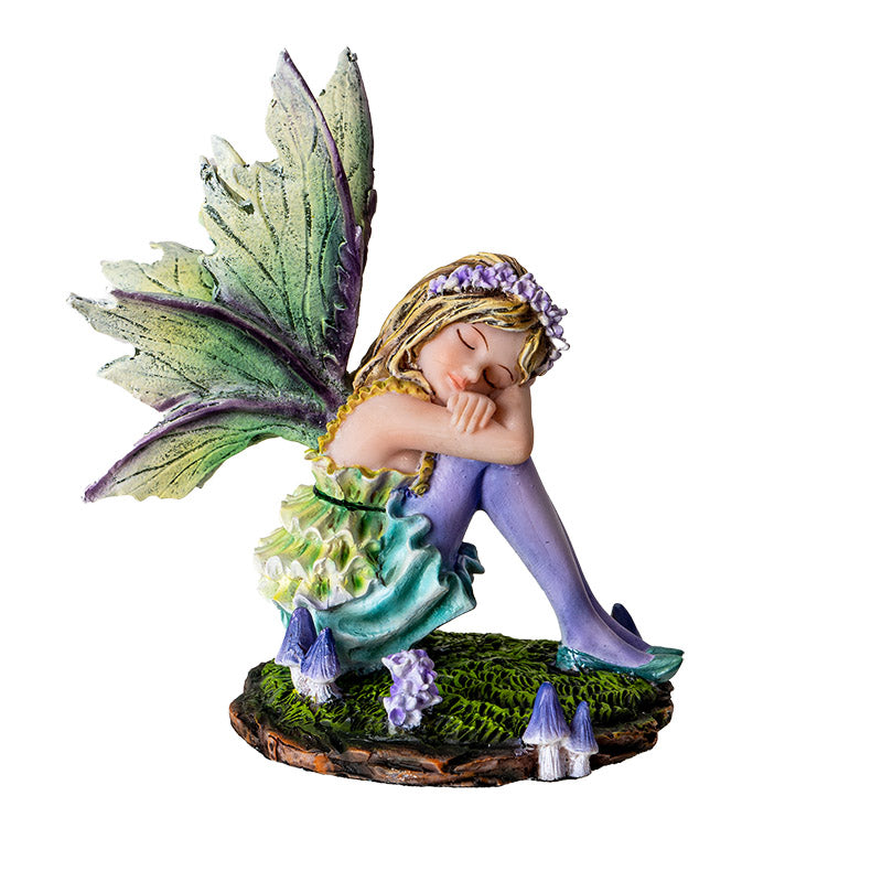 Fairy Figurine with blond pixie sleeping on moss, green wings & dress with purple stockings, accents, mushrooms