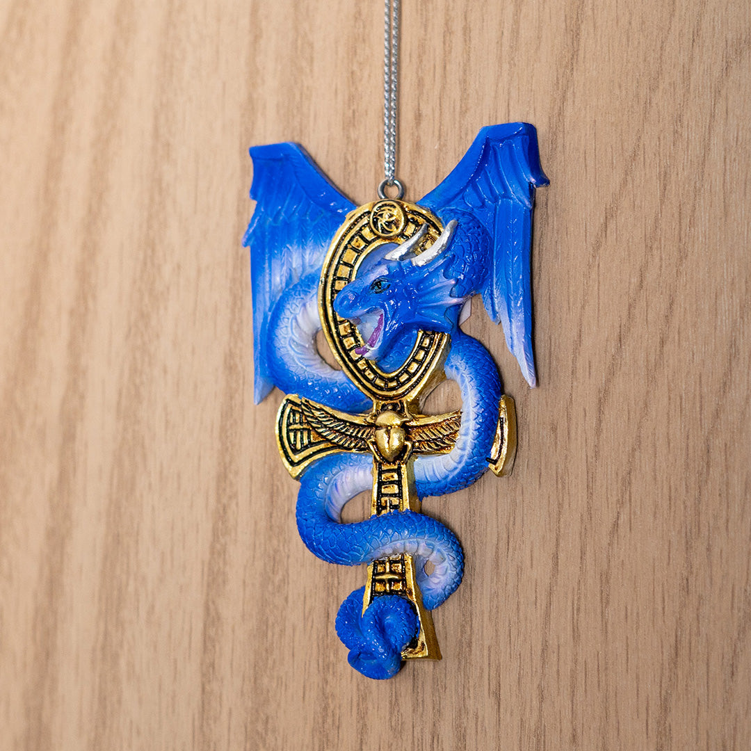 Ornament of blue dragon curled around golden Egyptian ankh