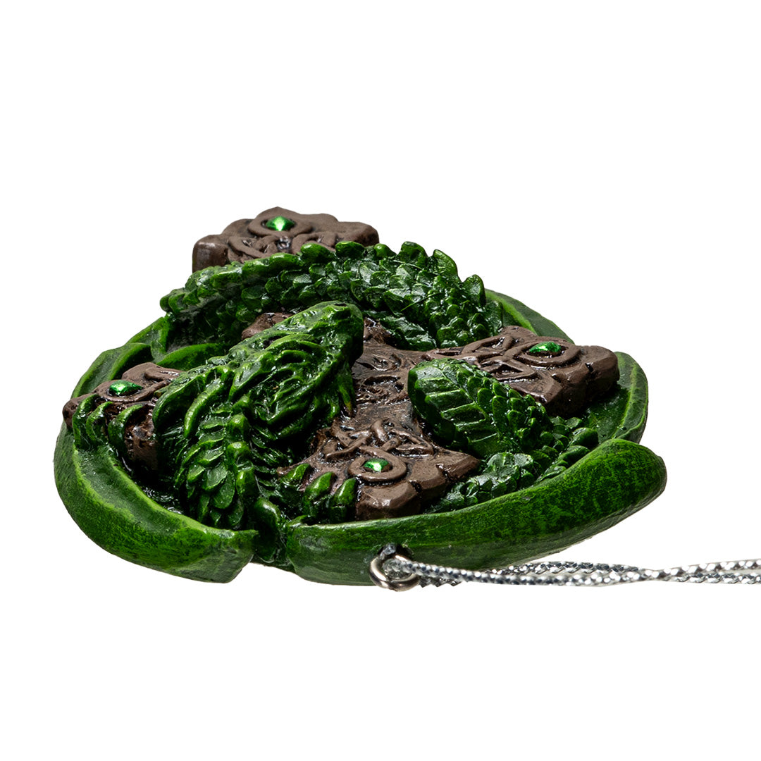 Ornament of green dragon curled around brown Celtic cross with knotwork, shown top down