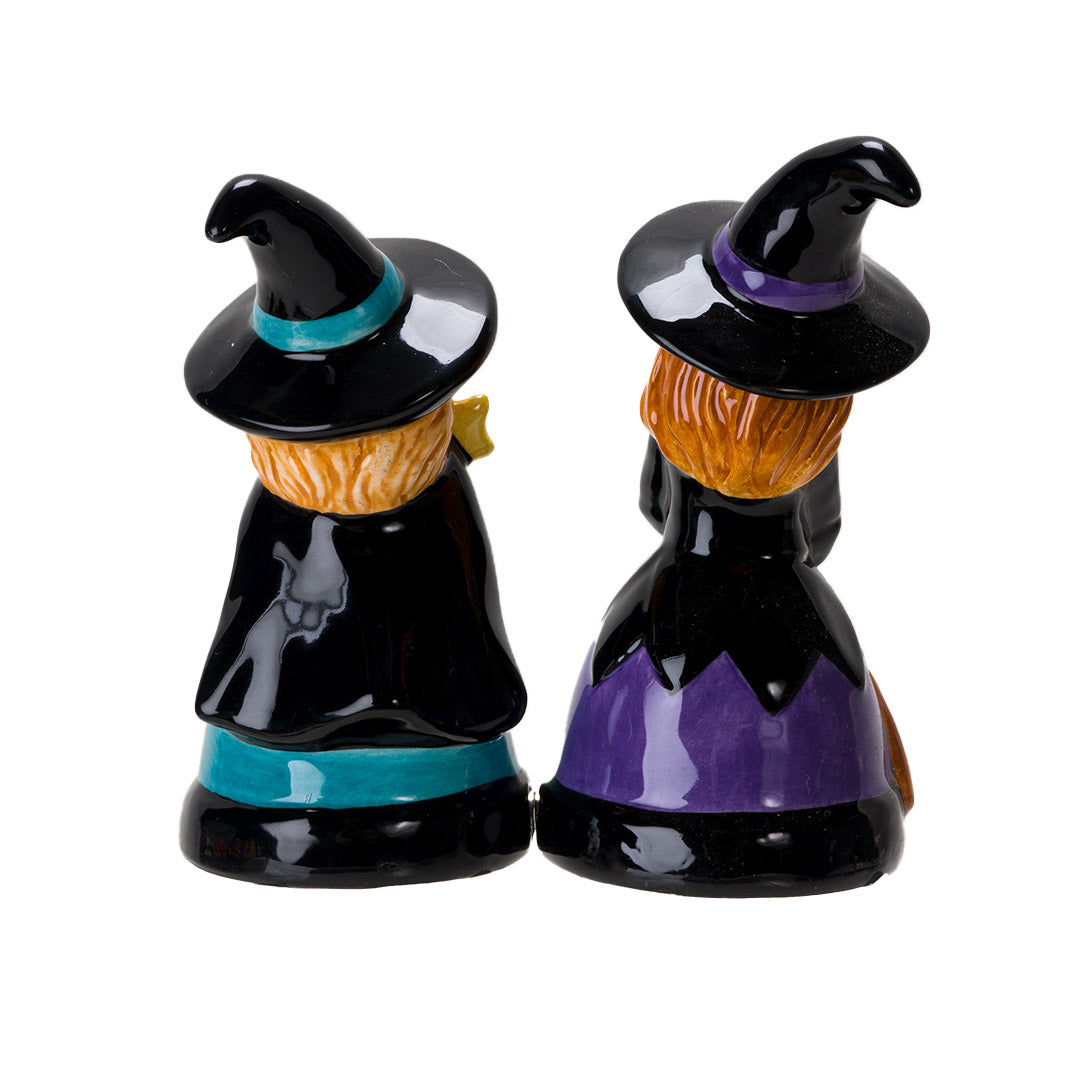 Salt & Pepper shakers shaped like witches in black hats and dresses. One accented in purple holding a broom, the other with blue accents holding a star wand. Shown from the back