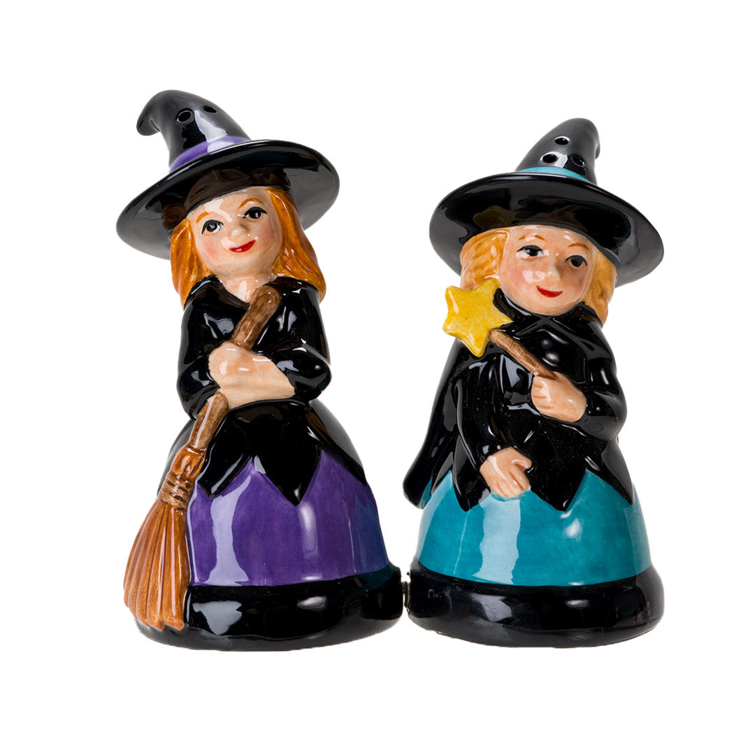 Salt & Pepper shakers shaped like witches in black hats and dresses. One accented in purple holding a broom, the other with blue accents holding a star wand