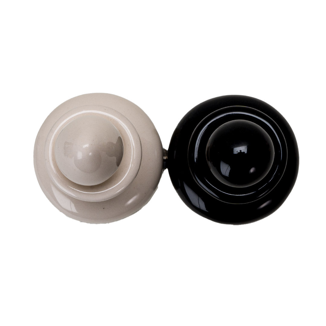 Salt and pepper shakers shaped like potion bottles. attached via magnets to one another