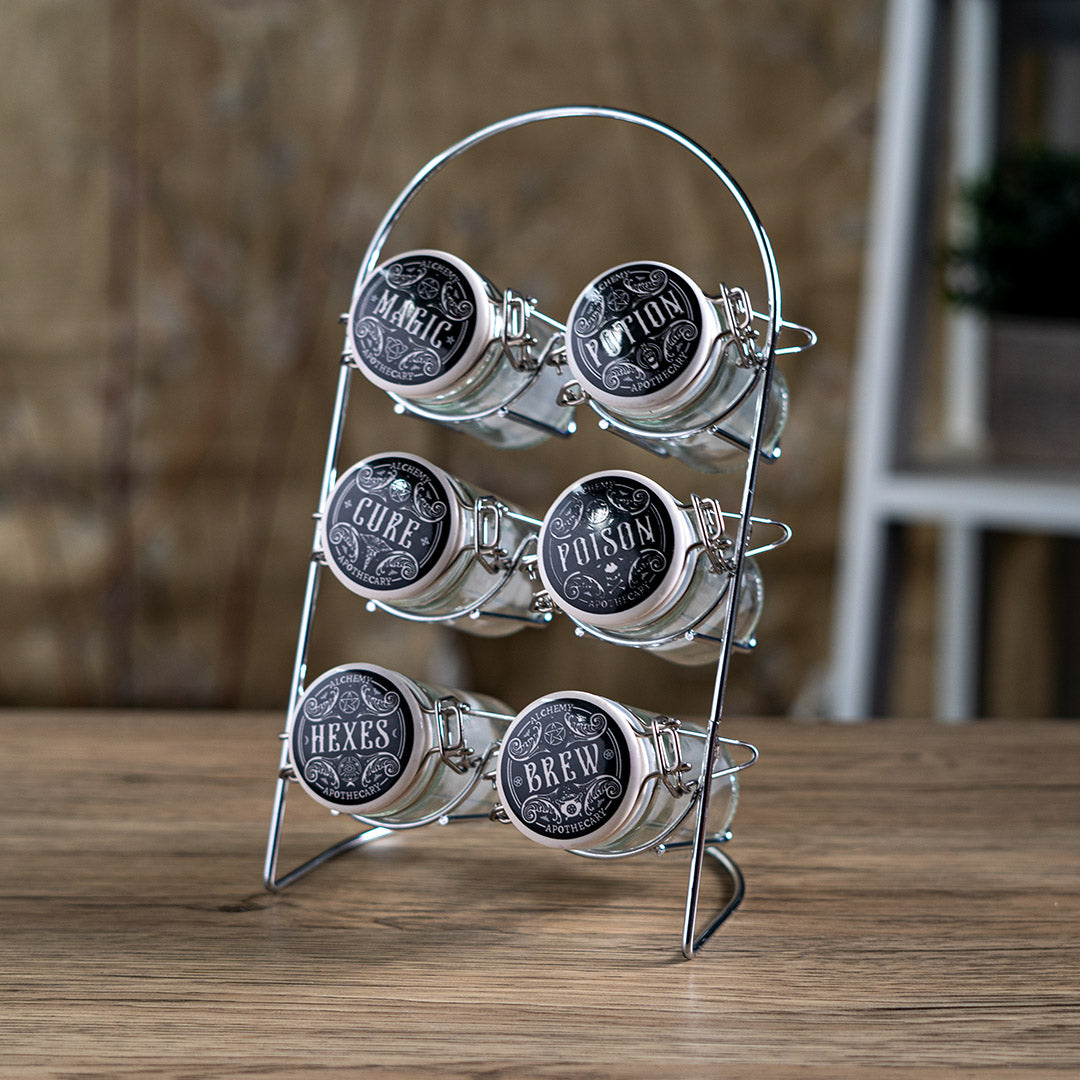 Spice rack with glass jars labeled 'Magic', 'Cure', 'Poison', 'Hexes', 'Brew' and 'Potion'