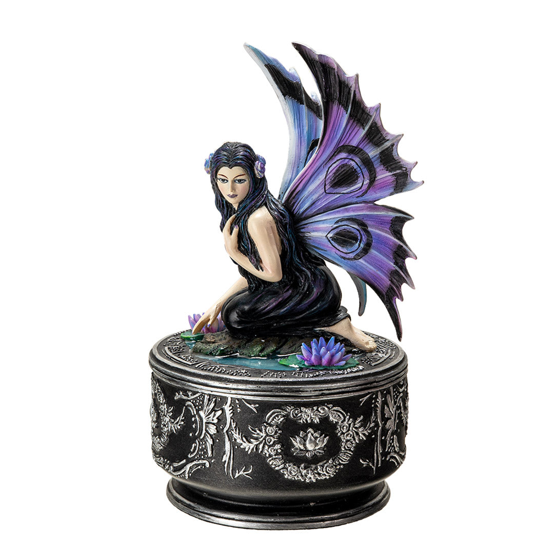 Trinket box with black base and silver designs. On the lid is a fairy in black dress with purple and blue wings accented in black, sitting amidst water lilies