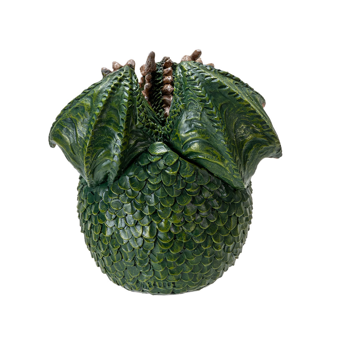 Figurine of a green dragon with red wings and tan belly hatching from an emerald egg with detailed scales, shown from the back