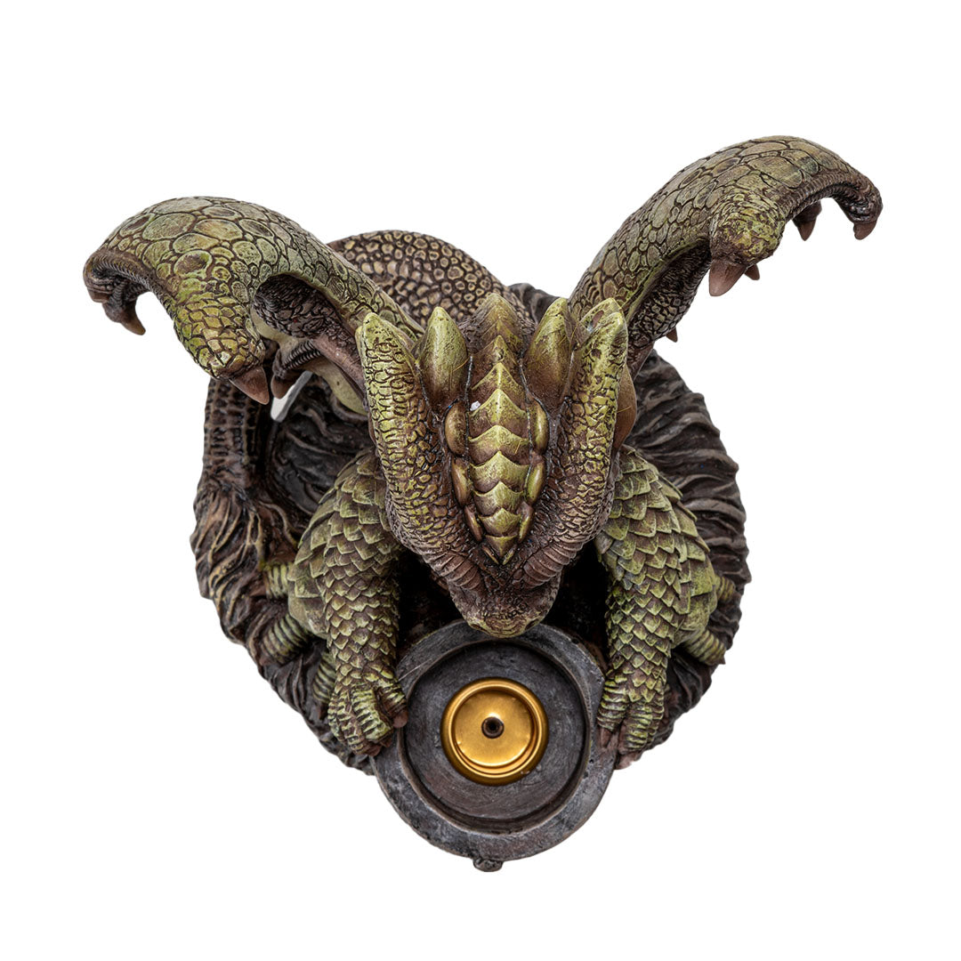 Candleholder figurine with tan/green dragon, red eyes, sitting with a cauldron. Shown top down with spot for candle or incense