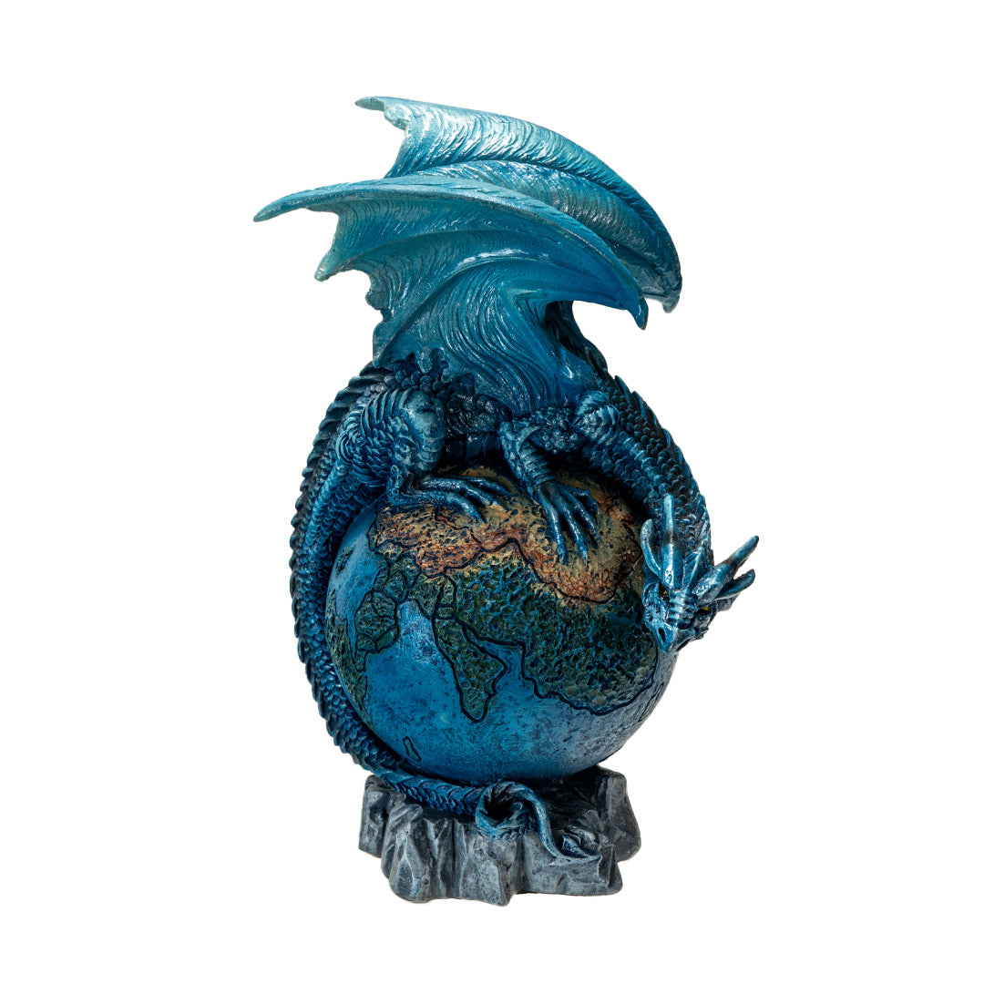 Dragon figurine, perched on planet earth. Blue dragon with tail curled around the globe