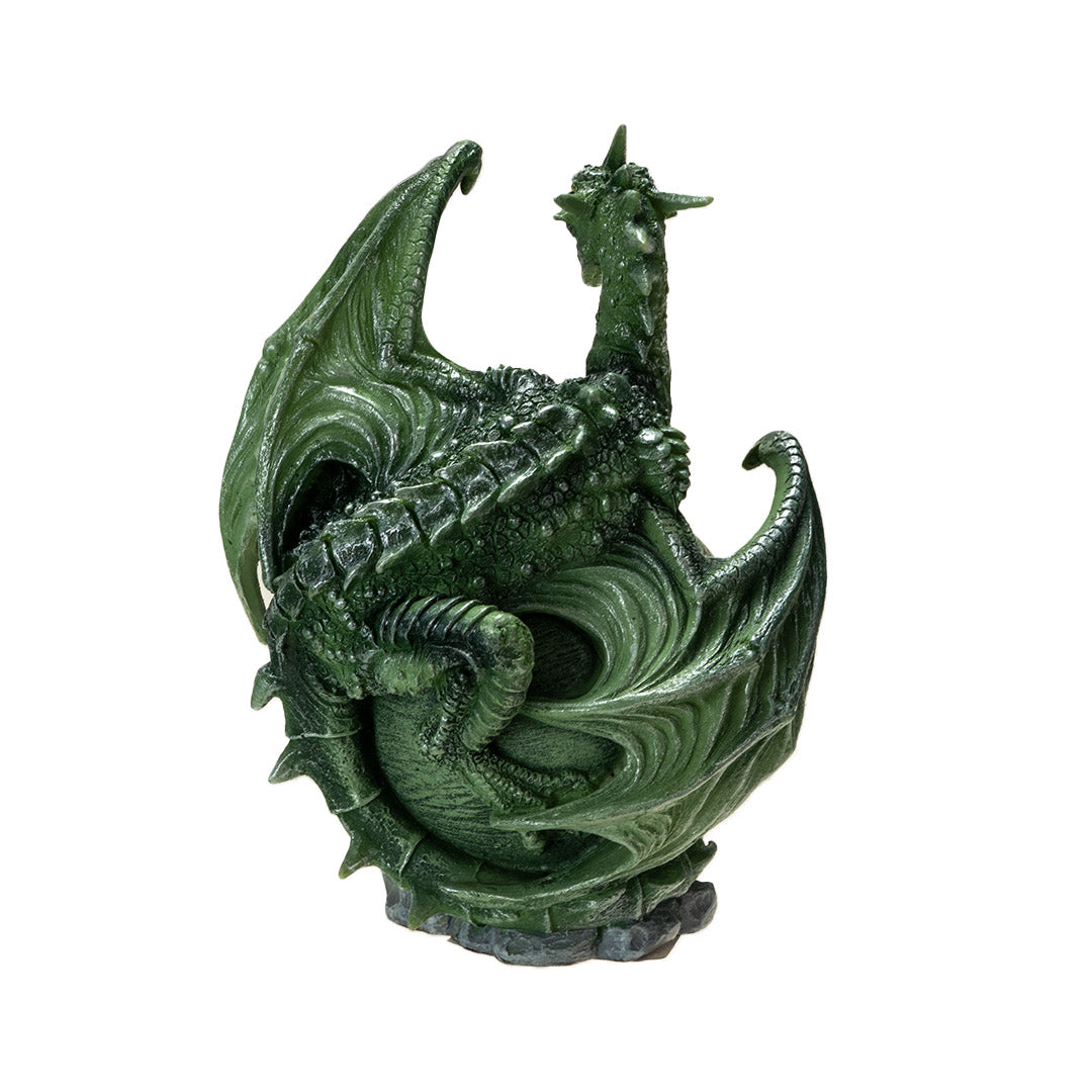 Figurine of a green dragon with open mouth and scorpion tail curled around a light green planet on a rocky base, shown from the back