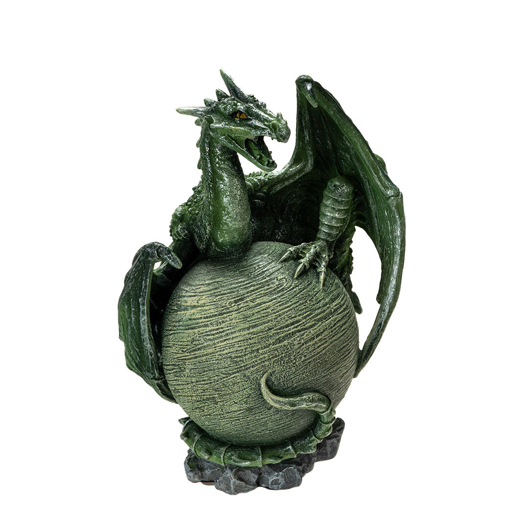 Figurine of a green dragon with open mouth and scorpion tail curled around a light green planet on a rocky base