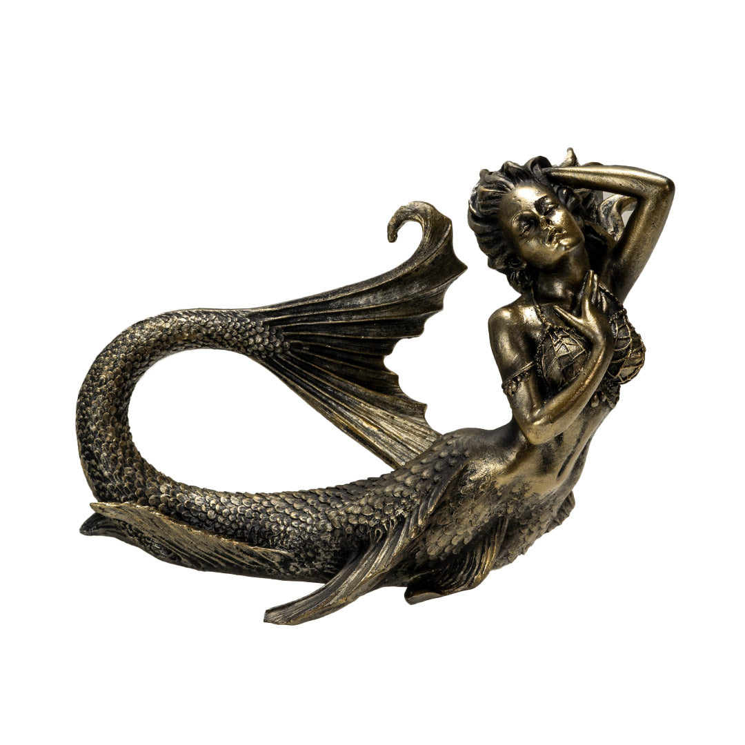 Bronze hued mermaid figurine laying down, with detailed fins and scales, netting top, flowing hair
