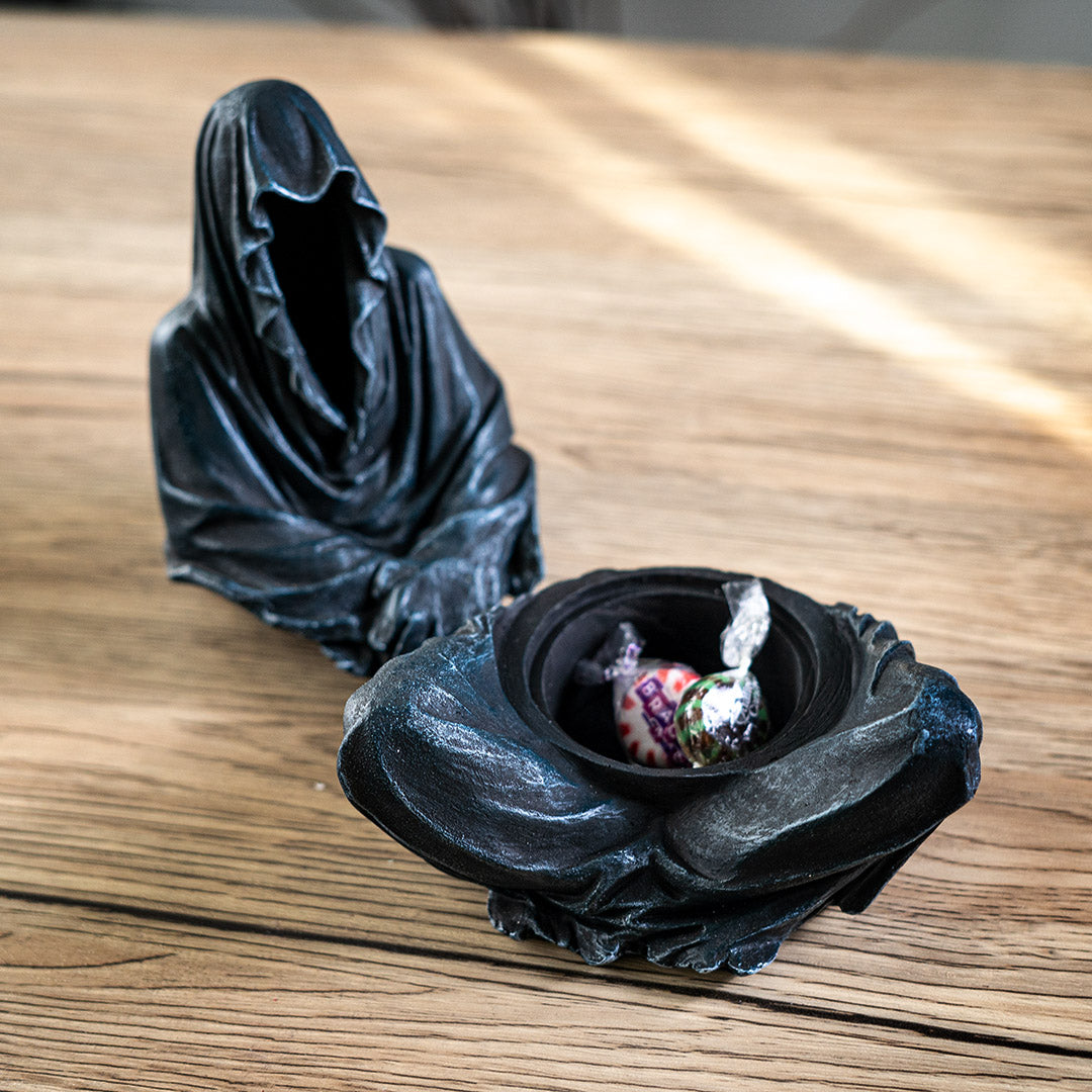 Seated Grim Reaper incense burner/box, shown with candy