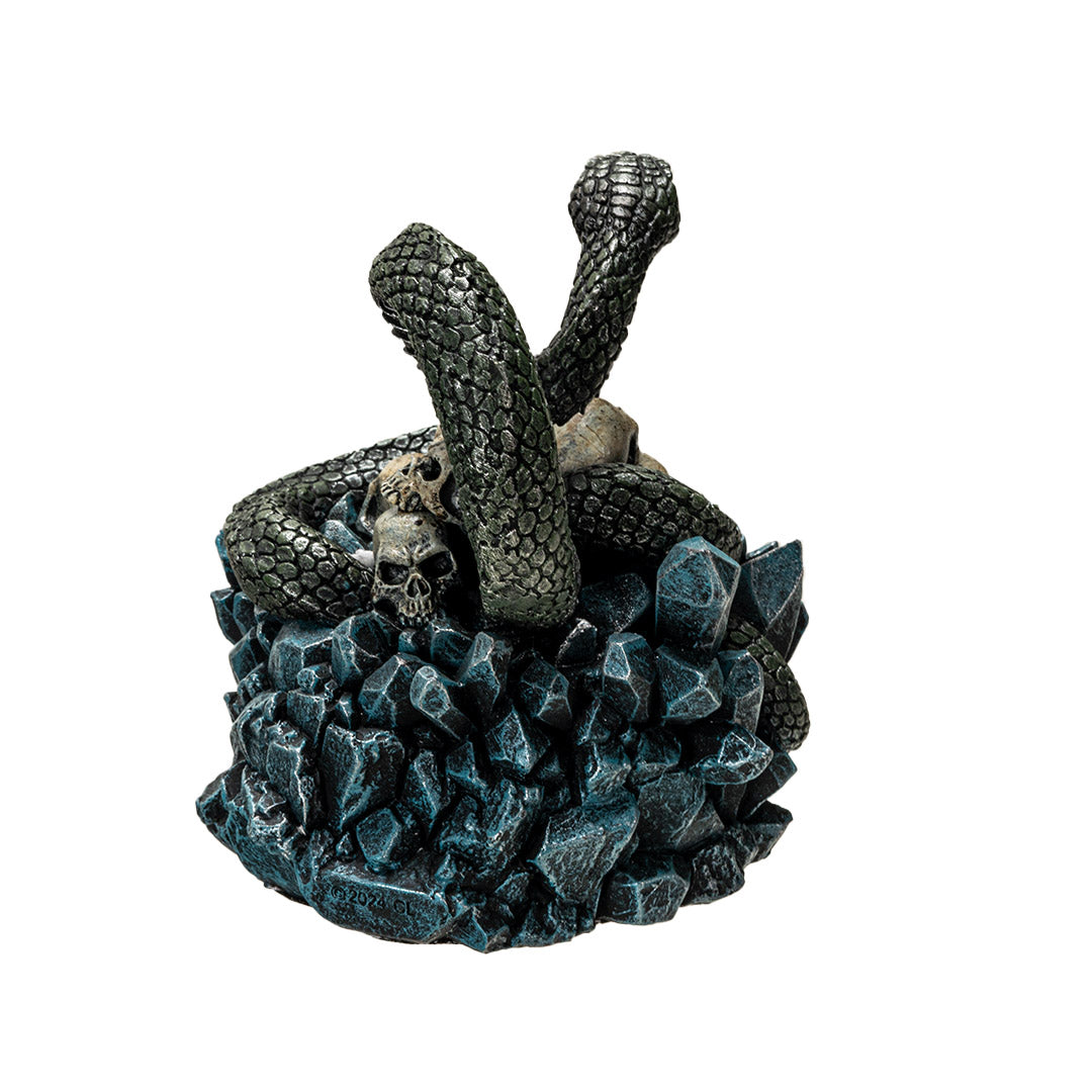 Trinket box, blue crystals on base with yellow-eyed green snake twining through human skull pile, shown from back