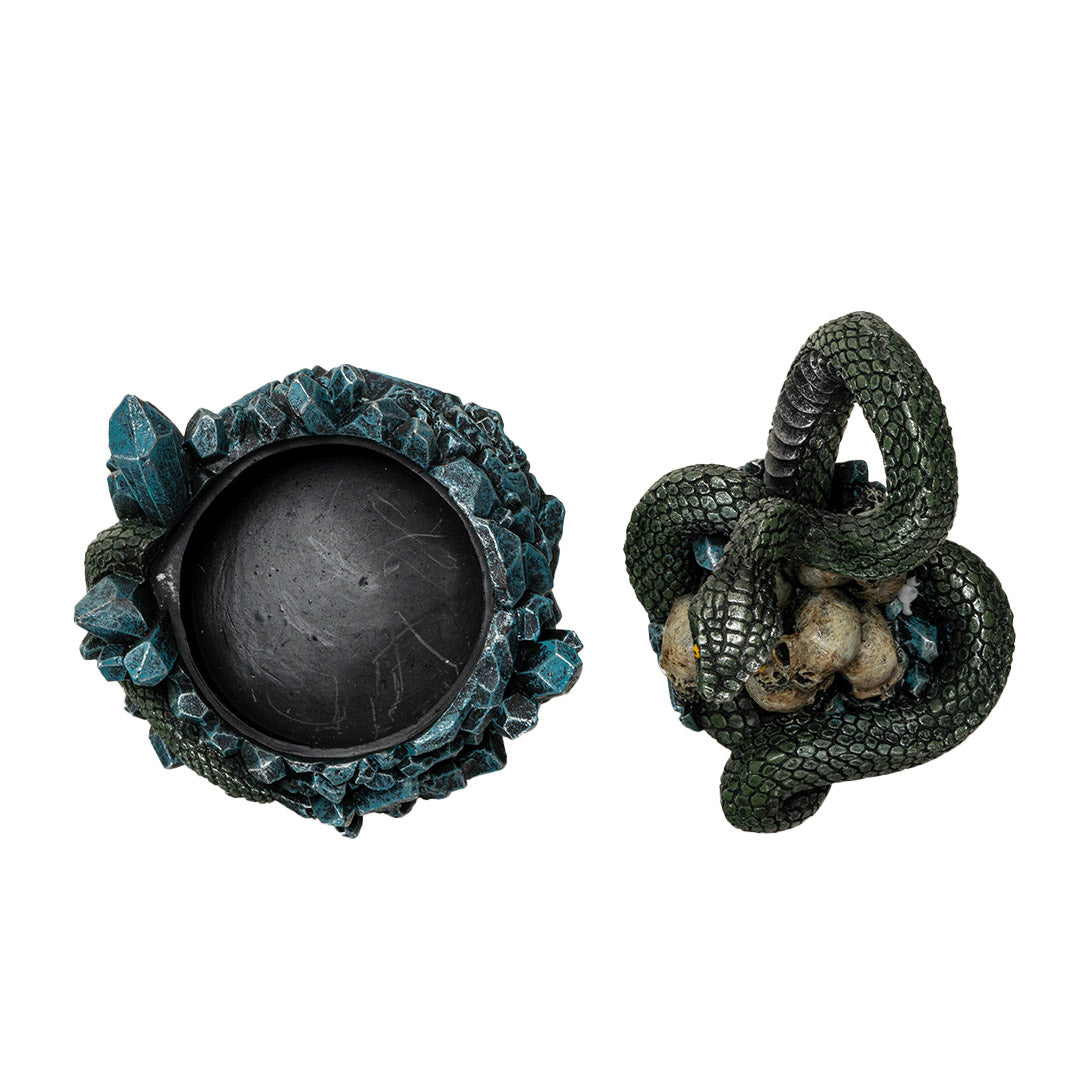 Trinket box, blue crystals on base with yellow-eyed green snake twining through human skull pile, shown open from top