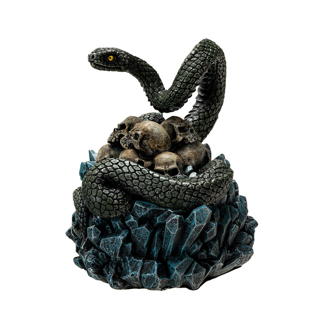 Trinket box, blue crystals on base with yellow-eyed green snake twining through human skull pile
