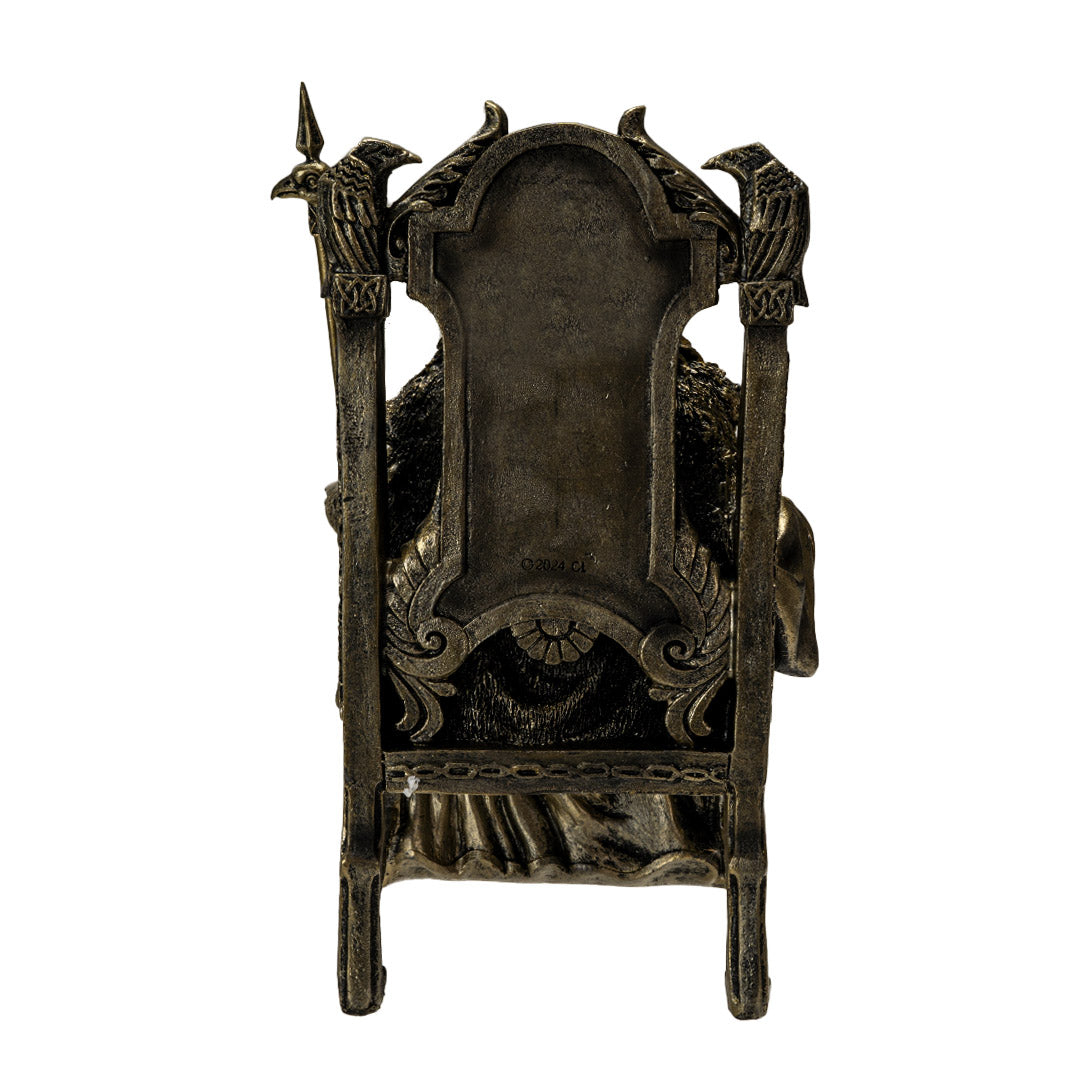 Figurine in faux bronze of Norse god Odin on throne with ravens and staff, shown from back