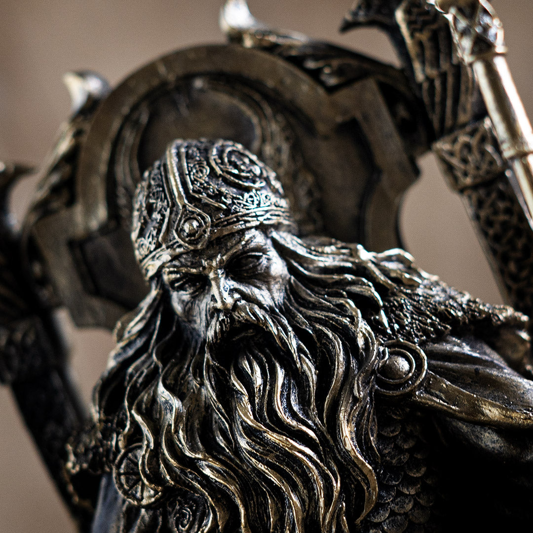Closeup of stern Norse god Odin in helmet on throne