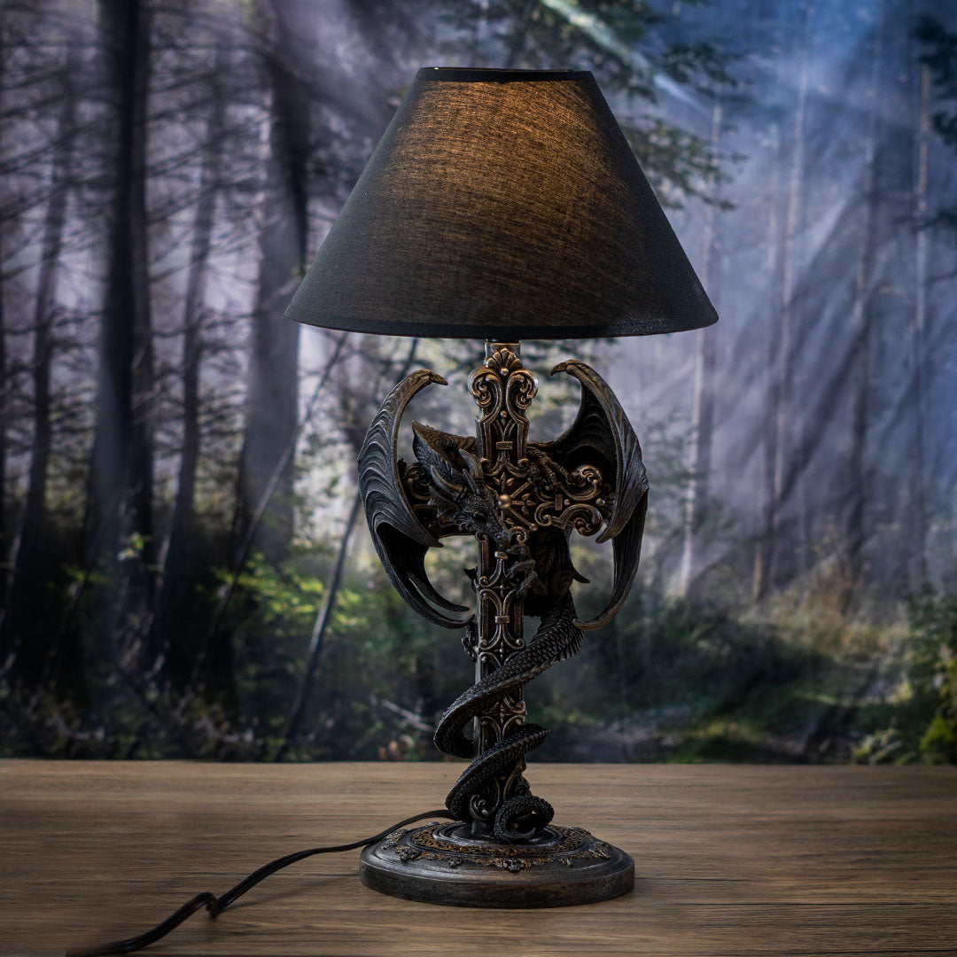 Lamp with black shade, black dragon twining around the base in faux-silver shaped like a Gothic Celtic cross