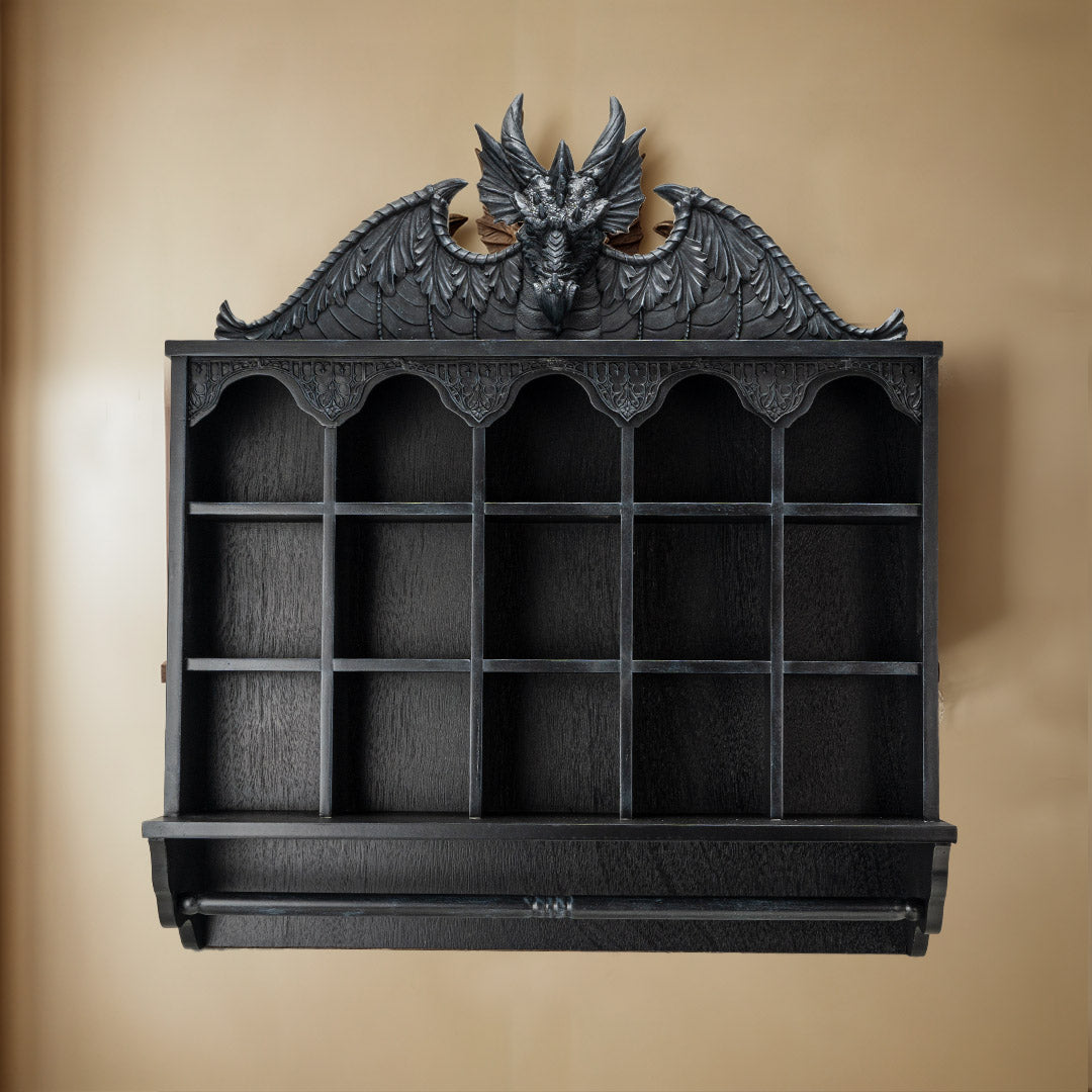 Wall shelf in black with dragon at the top, compartments and hanging rod