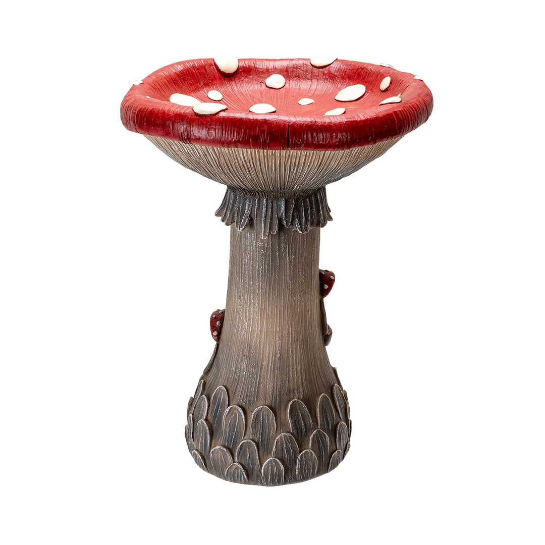 Back of the toadstool mushroom house, grey-tan, red top with white spots