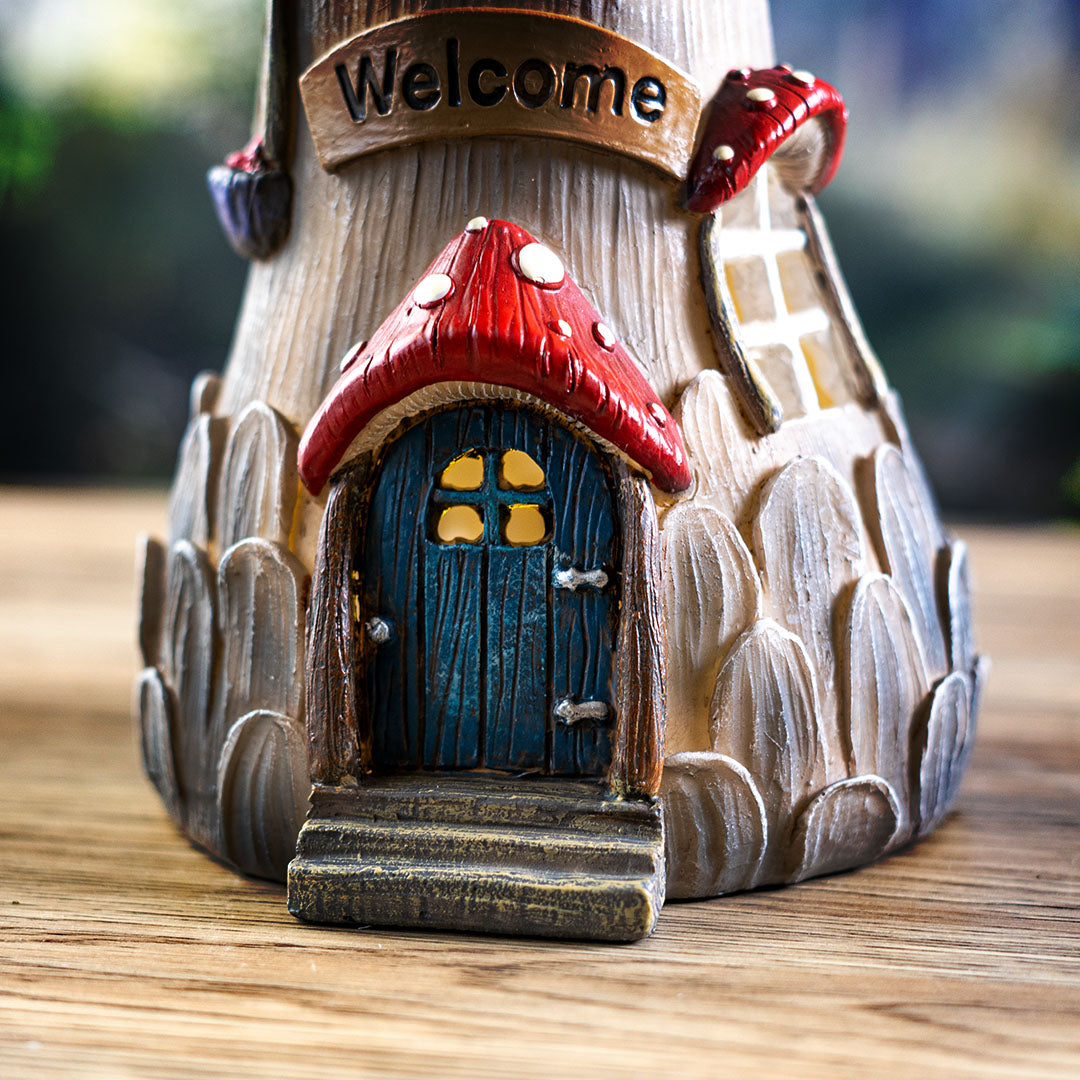 Closeup of blue door lit with LED light, welcome sign above