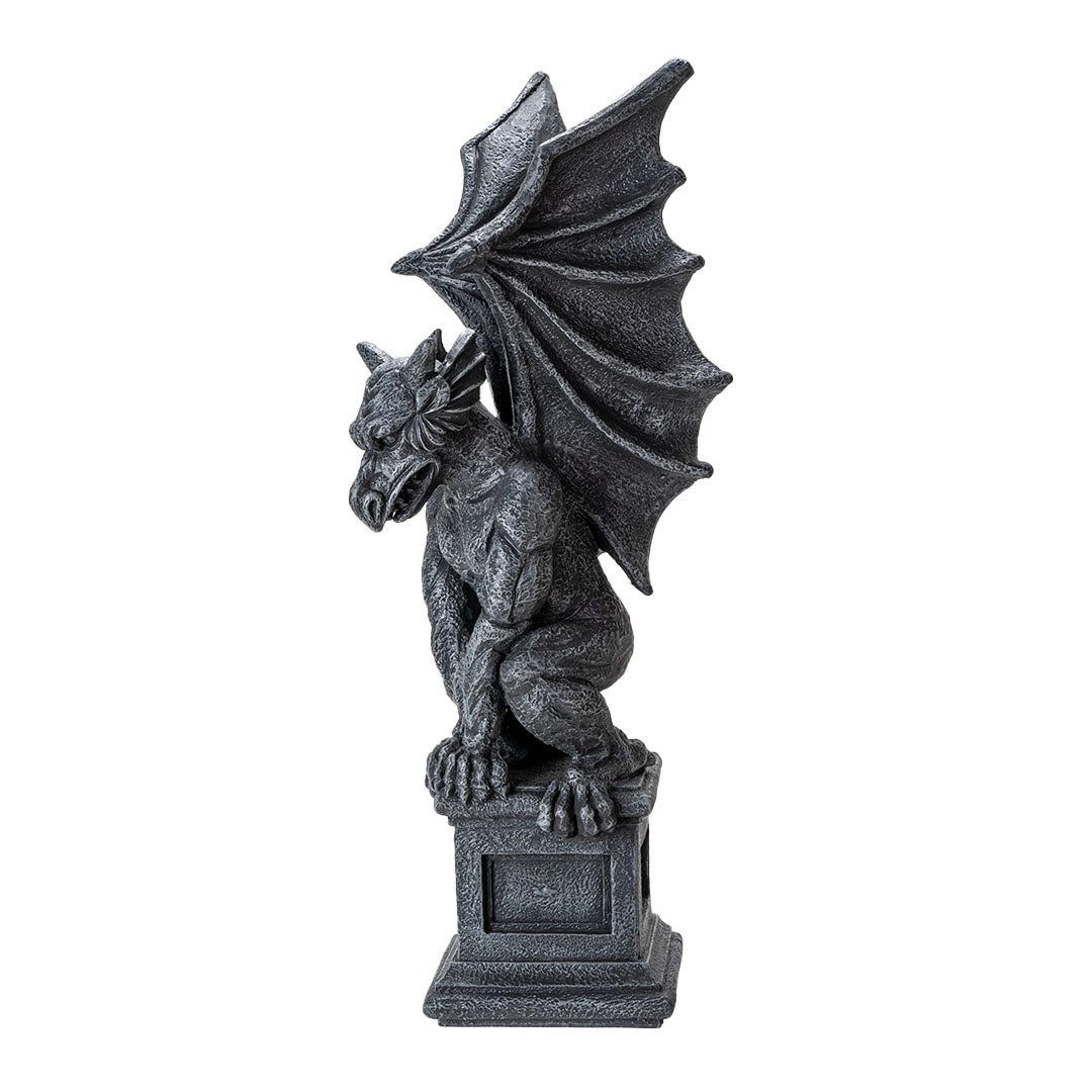 Figurine of a gray faux-stone gargoyle with dragon wings perched on a column