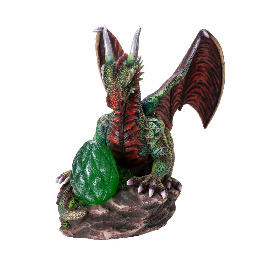 Figurine of green dragon with red wings, spines, eyes and belly, with an egg in front that can glow with LED lighting
