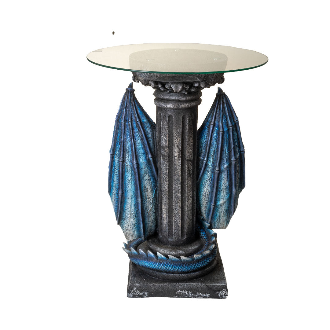 Glass topped table. Base is a blue dragon with spread wings holding a sword, shown from the back - faux-stone column