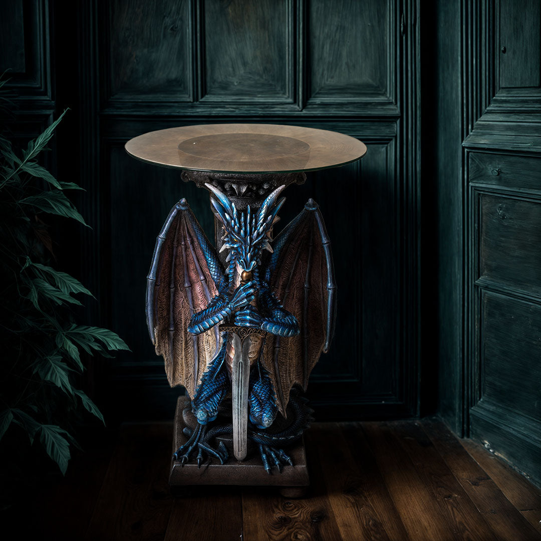 Glass topped table. Base is a blue dragon with spread wings holding a sword