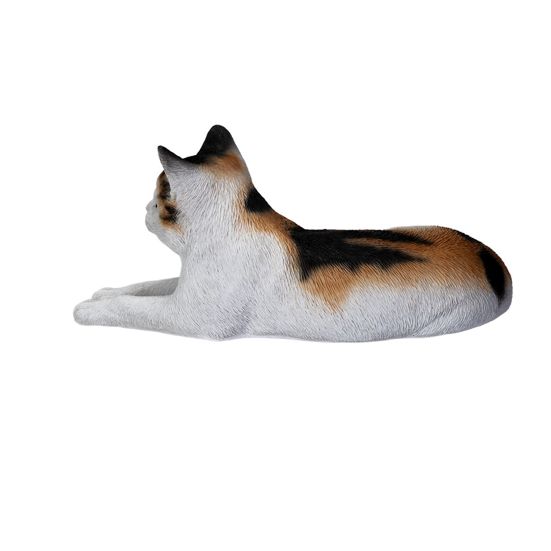 Calico cat figurine, lying down pose