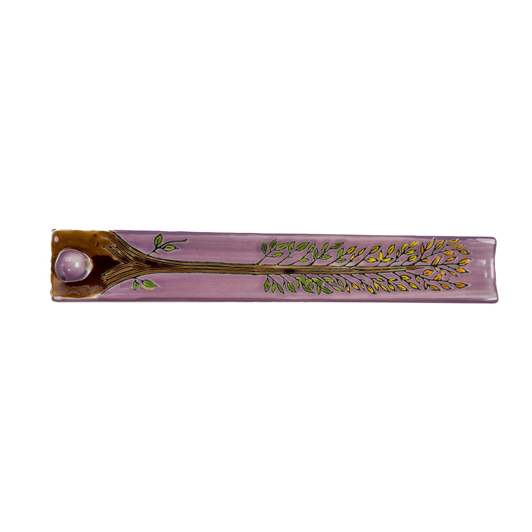 Purple ceramic incense burner with tree of life design painted on, leaves in orange, yellow and green