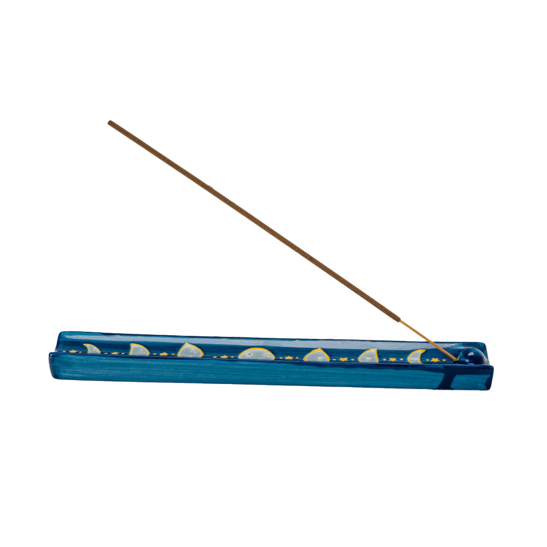 Blue ceramic incense burner/holder with the phases of the moon and stars painted on