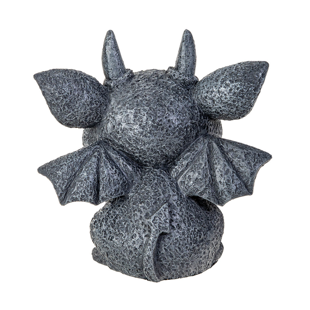 Statue of a gargoyle creature with large eyes, horns and wings in faux-stone finish, shown from the back