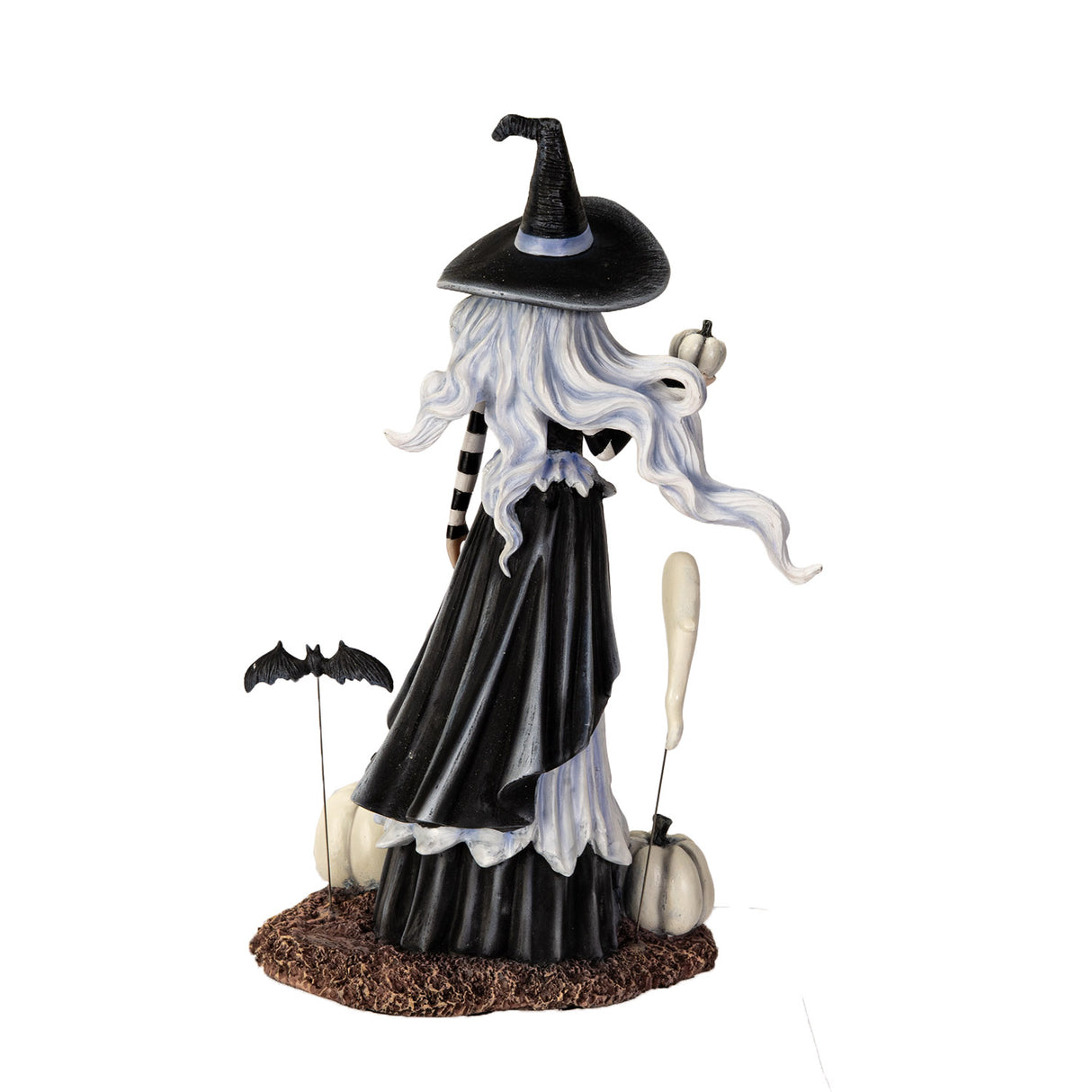 Halloween-themed figurine of a witch with white pumpkins and a ghost and bat, shown from the back