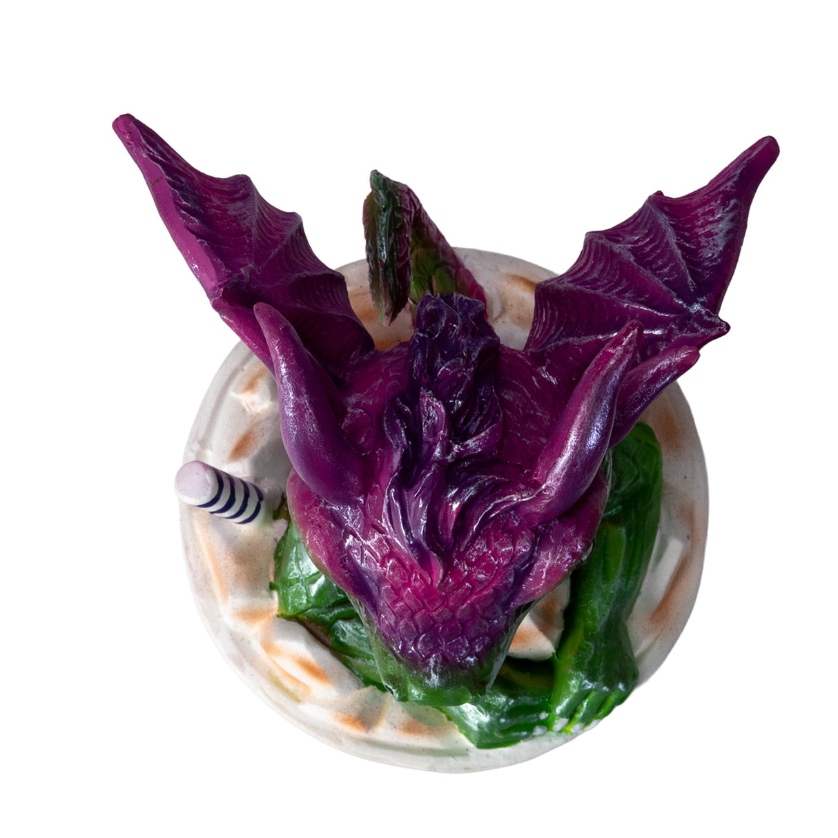 Dragon figurine sitting in an 'Iced Coffee' cup with a straw, shown top down