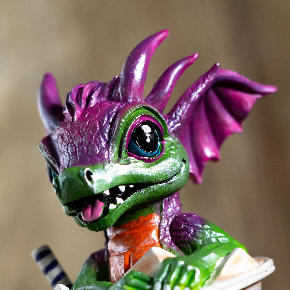 Close-up of a green and purple dragon figure