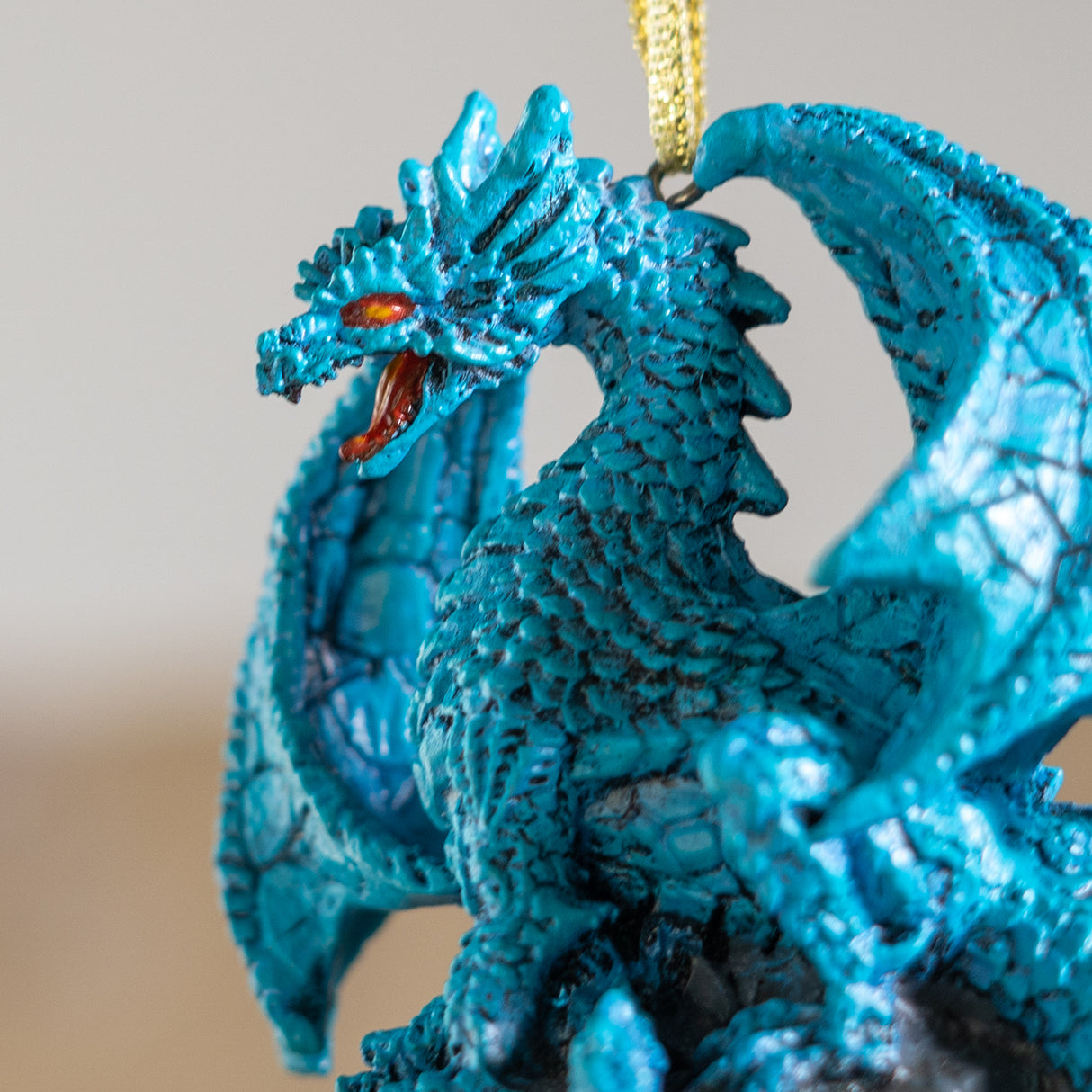 Closeup of blue dragon with red eyes